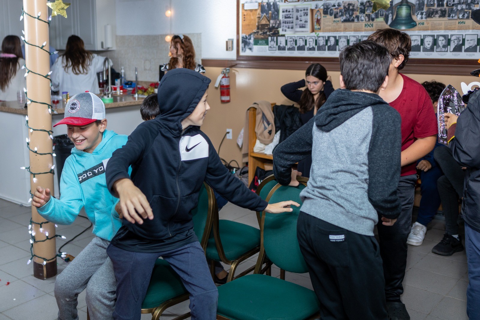A group of boys playing musical chairs