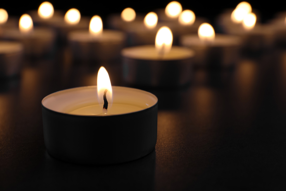 a lit votive candle